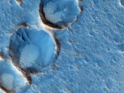 Martian wind-blown deposits inside eroded craters