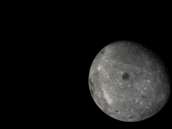 The far side of the moon, with distant Earth in the background, is visible in this photo taken by the moon-orbiting module of the Chang'e 5-T1 mission.