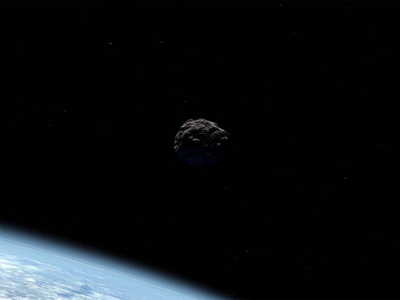 Artist's concept of an asteroid passing Earth.