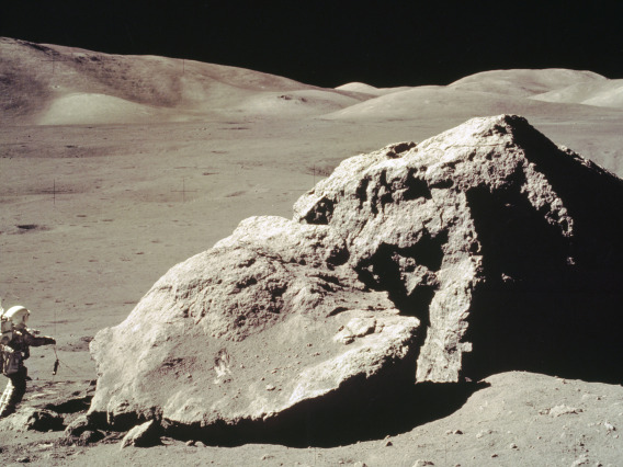 In this Apollo 17 onboard photo, scientist and astronaut Harrison H. Schmitt collects rock samples from a huge boulder near the Valley of Tourus-Littrow on the lunar surface. (Photo: NASA)