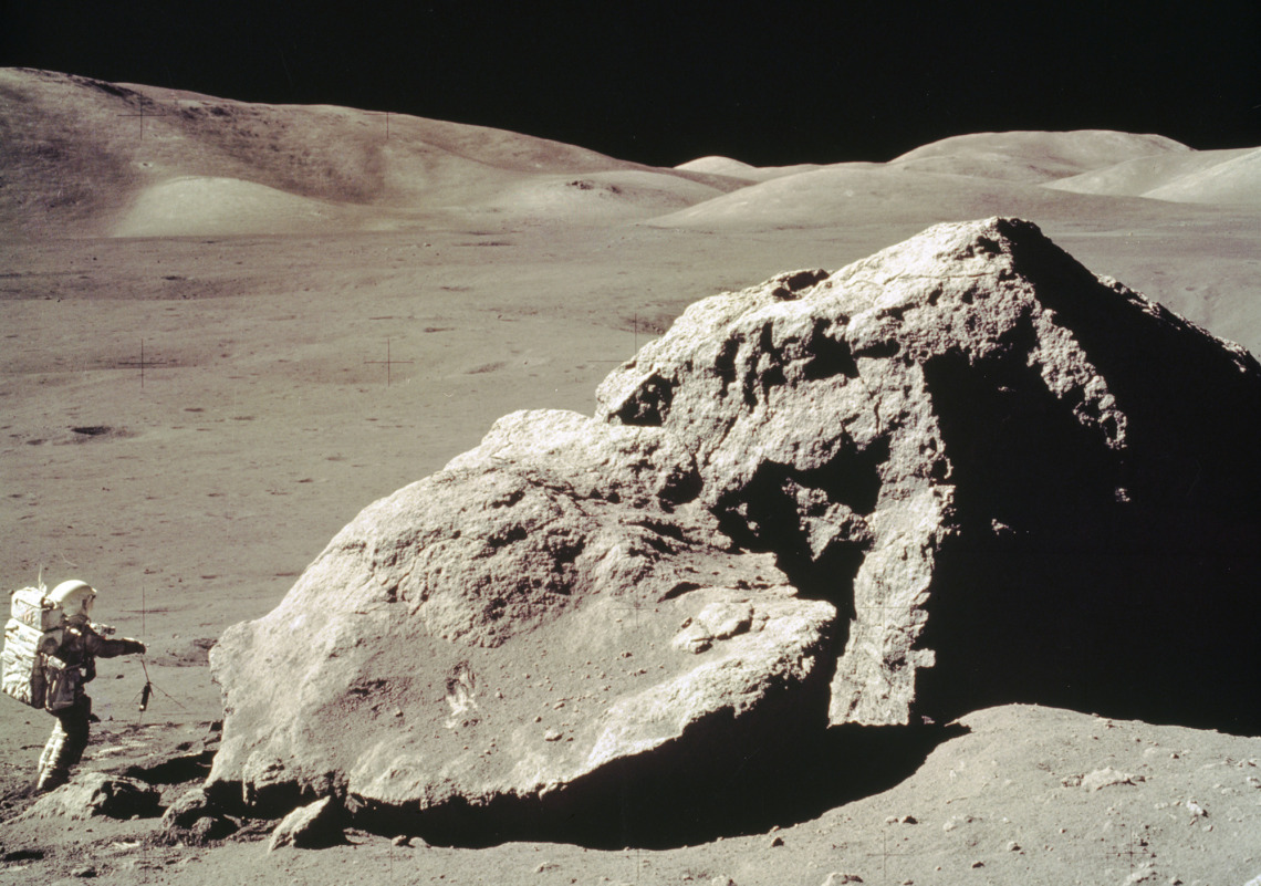 In this Apollo 17 onboard photo, scientist and astronaut Harrison H. Schmitt collects rock samples from a huge boulder near the Valley of Tourus-Littrow on the lunar surface. (Photo: NASA)