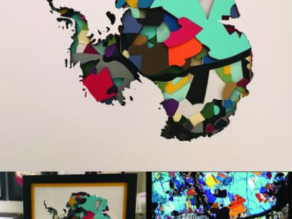 A sculpture made of stacked colored paper cut to appear as mineral grains and the outline of Antarctica as the top layer.