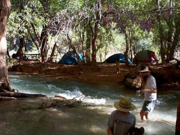 We got into Havasupai village around dinner time, and had some food at the Cafe there. Then we hiked the last two miles to the campgrounds. However, we got there after the sun had gone down, and ended up having to cross the river to get to our campsite. Here's a picture from the next day of Dave going over to the campsite.