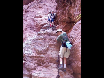 There was a precarious path that wound back and forth between the travertine deposits that led down to the bottom of the waterfall, and the last step was a doozy.