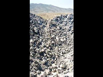 Danny Boy, 0.42 kilotons detonated in the dry basalt of Checkerboard Mesa. The burst depth was 34m underground and the resultant crater measures 66m across and 19m deep.