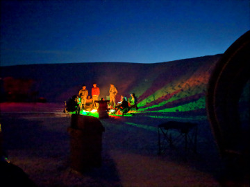 Campfire at White Sands NM with green lantern