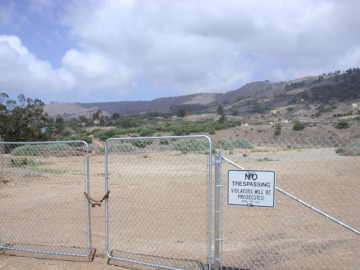 Fence with No Tresspassing sign.