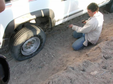The monotony of the long journey home was interrupted by a flat tire.