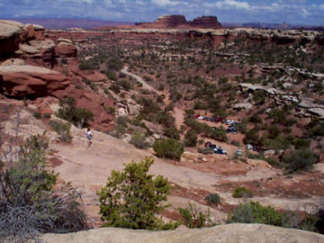 This is a view from near the top of the Elephant Hill ascent, Barb looks out over the scene. You can see the parking area at the base of the Hill, and the easy dirt road that we came to the Hill from, as well as some beautiful Canyonlands scenery.