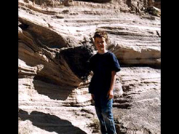 Ian shows off stratigraphy (volcanic bomb and sag features) in the maar volcanic deposits.