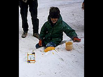 After camping in the snow, we ran south for warmth. We had breakfast at White Sands National Monument where Ian showed us how to make out own kitchen volcanoes. Here we see the bright-yellow (sulfurous?) soap lava spill onto the gypsum sands and down into the sleeping village below.