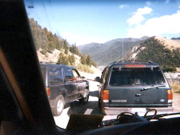 The vans share some goodies while looking at Earthquake Lake.