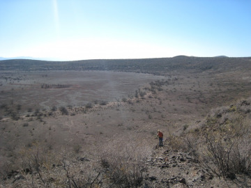 Examining the floor of another maar crater.