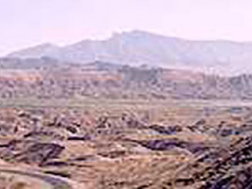 Mormon Mesa, capped by the mysterious wind-deposited caliche. Lake Mead in the center right.