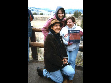 Rachel, Kim, and Barb display the field trip guide.