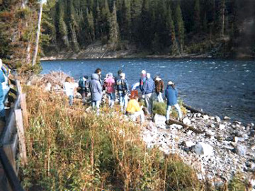 Friday we woke up a little more rested. It was partly cloudy and not too cold. Our first stop was at LeHavre rapids, where the resurgent dome uplift of the Yellowstone caldera is causing rough water in the streambed. Here, Vladimir tries to teach the physics of uplift at 8:30 a.m.