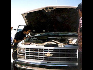 Of course, no LPL field trip would be complete without a van problem, but this time it was minor. A small leak was sprung in the cooling system. Laszlo diagnoses the problem.