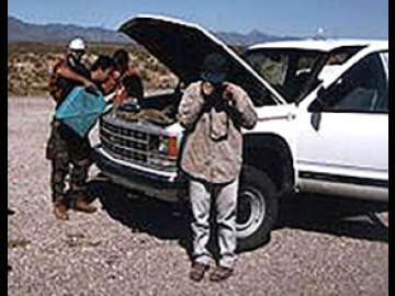 Laszlo tries all sorts of new coolants while the Zibi looks on and Will takes pictures of the ground. In the end, it was duct tape and twist-ties to the rescue--and the van was fine.