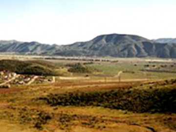 The Trans-Peninsular Mountains run down the western coast of Baja, and were formed in the same way as coastal California's mountains: as the Farallon plate subducted underneath the North American plate, melting and volcanism occured inland, close to the boundary. These volcanoes and plutons form a chain along the coast.