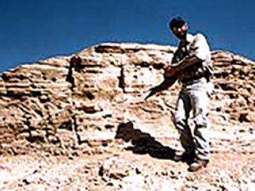 Will shows off stratigraphy (cross-bedding) in the maar volcanic deposits.