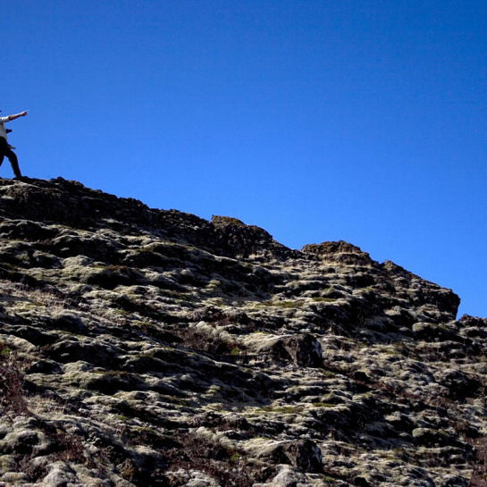 Dr. Christopher Hamilton and Dr. Andrew DeWet survey the Rauðhólar region and discuss geological methods.