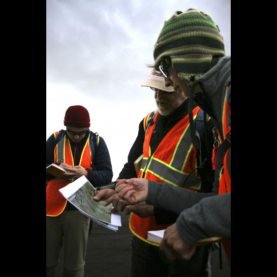 Sarah Sutton and Dr. Andrew deWet looking at a map of the Laki region. 