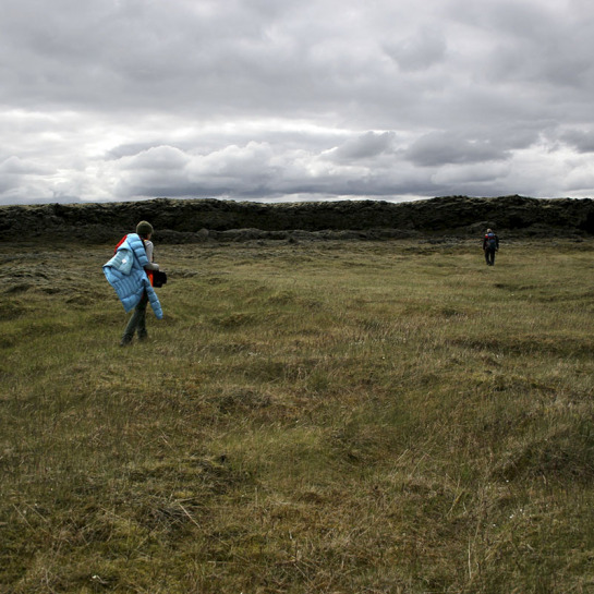 Amber Keske and Dr. Andrew DeWet walk through the Laki lava channel. The researchers would work several kilometers a day up and down the channel to collect data. 