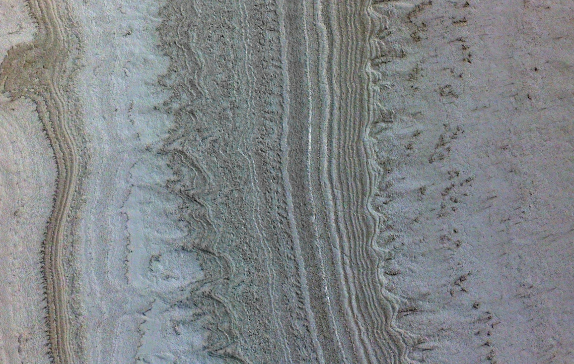 Taken by UArizona's HiRISE camera on NASA's Mars Reconnaissance Orbiter shows ice sheets at Mars' south pole.