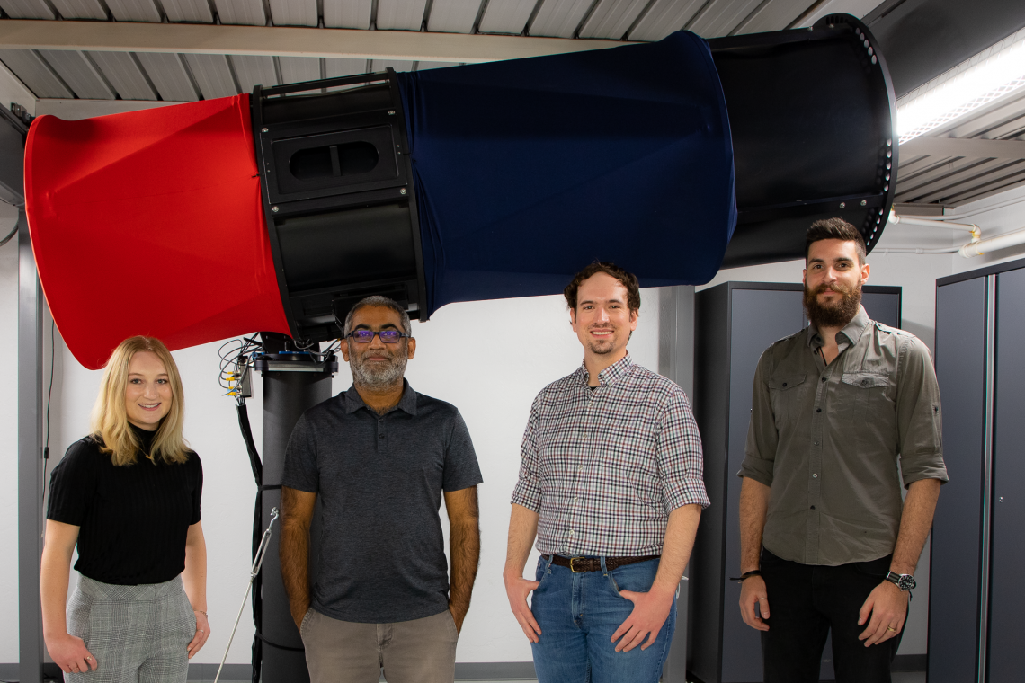 Reddy research team members in front of the RAPTOS telescope.