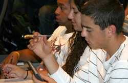A student uses his clicker in class.
