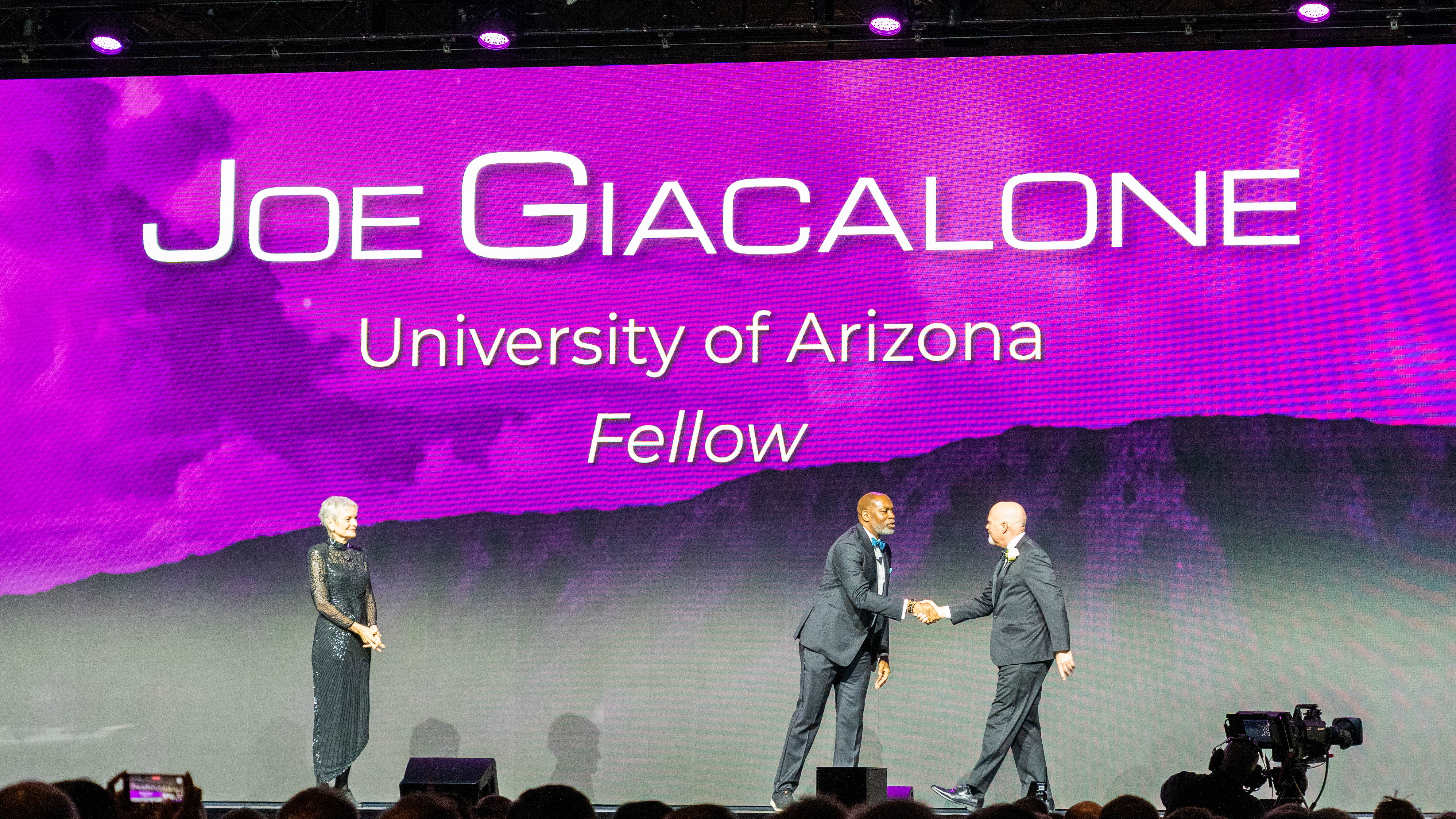 Joe Giacalone walks across AGU stage.