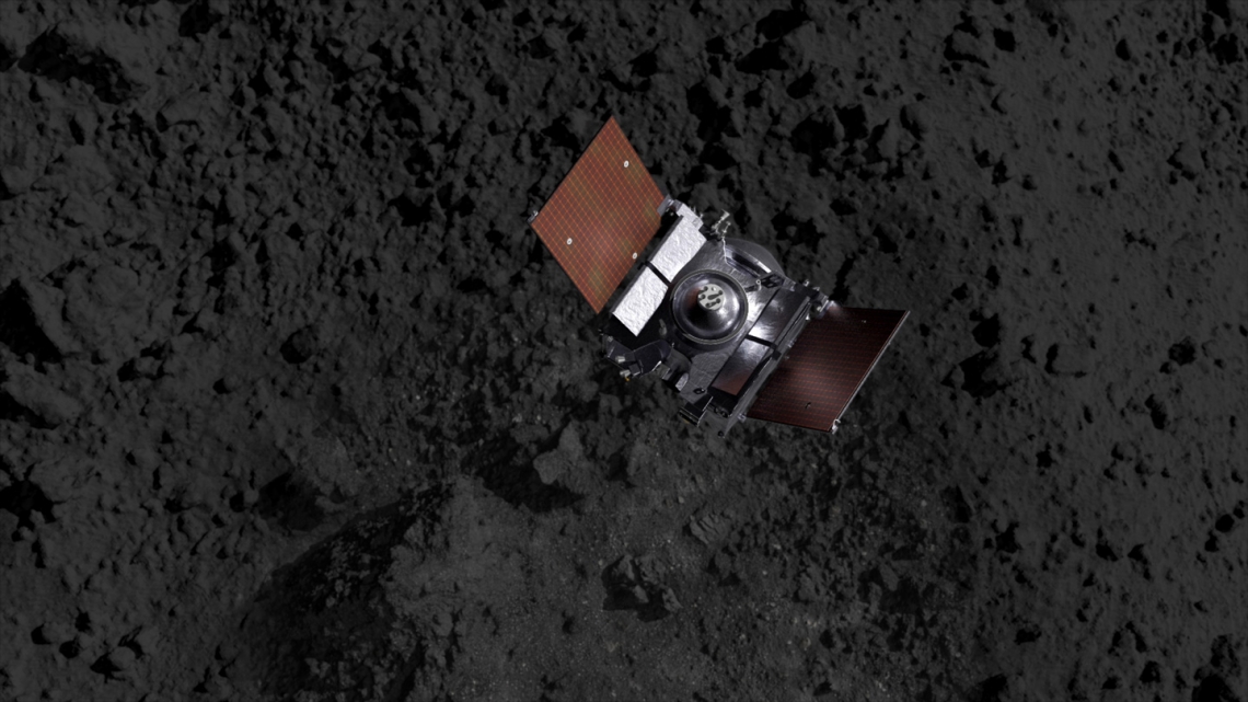 Artist's impression showing the OSIRIS-REx spacecraft descending onto Bennu's surface to collect a sample on Oct. 20. NASA/Goddard/CI Lab