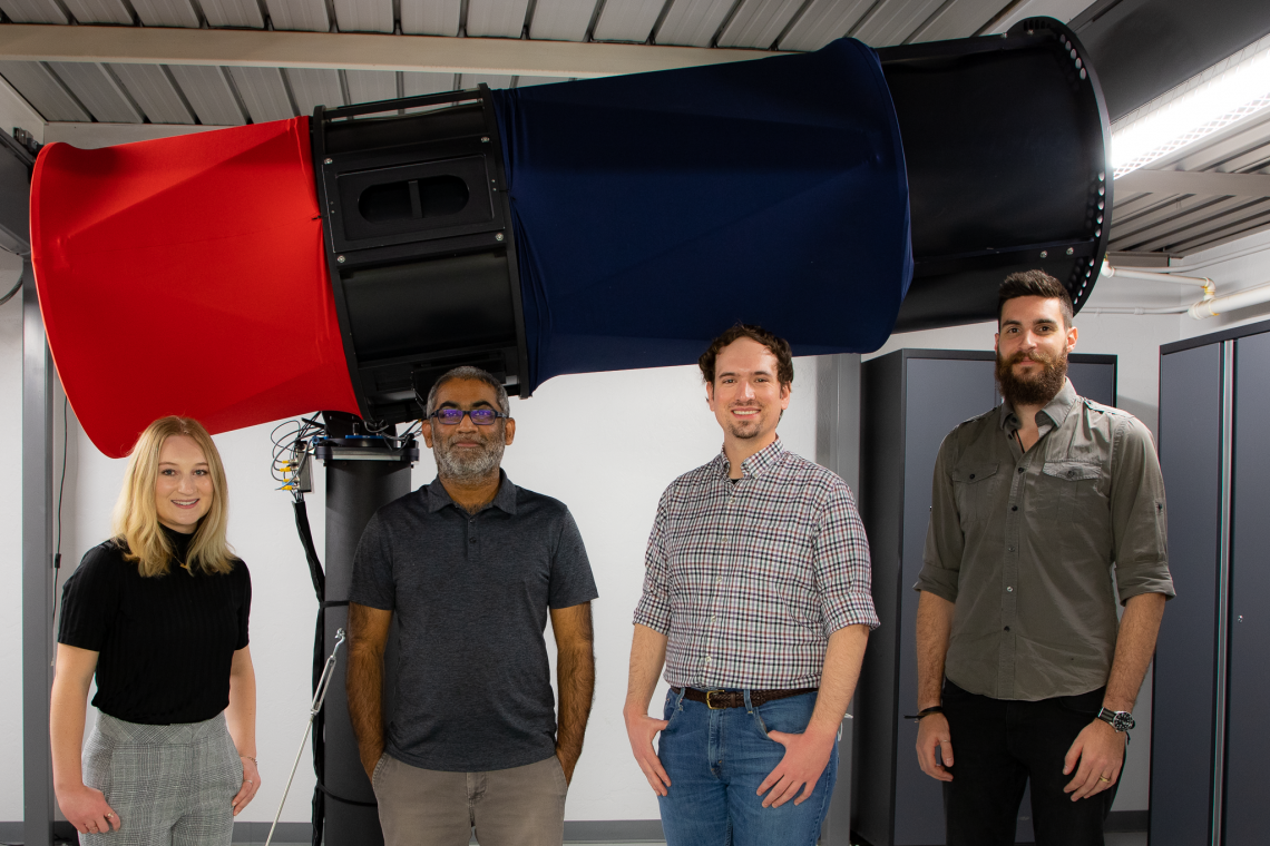 The UArizona Space Domain Awareness team - including Grace Halferty, Vishnu Reddy, Adam Battle and Tanner Campbell - stand in front of the RAPTORS-1 telescope on top of Kuiper Space Sciences Building. The team confirmed that the rocket booster slated to impact the Moon on March 4 is from the Chinese Chang'e 5-T1 mission and not from a SpaceX Falcon 9. Vishnu Reddy