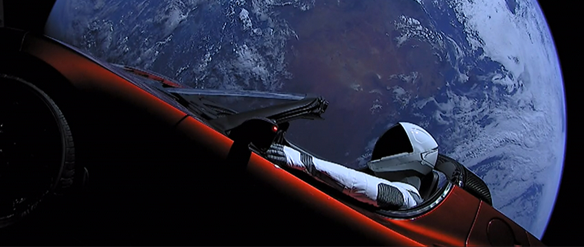 The Tesla Roadster and its mannequin passenger, Starman. This image was captured by cameras onboard the vehicle. (Image: SpaceX)