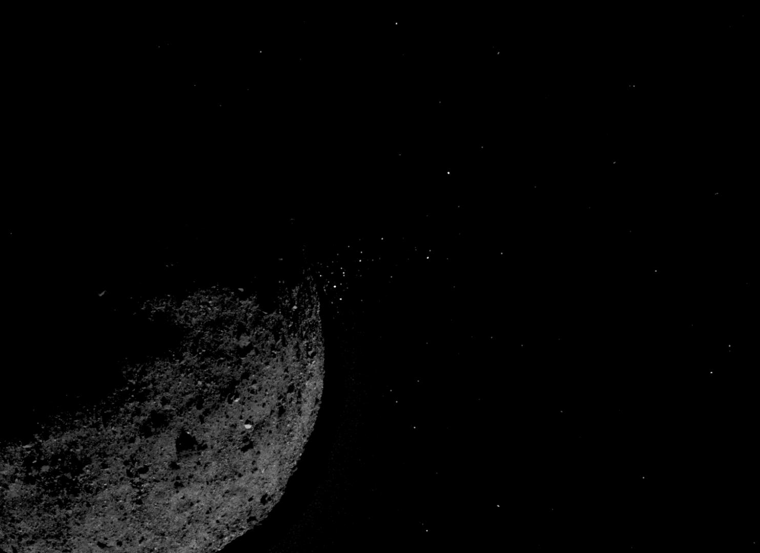 This view of asteroid Bennu ejecting particles from its surface on January 19, 2019, was created by combining two images taken by the NavCam 1 imager onboard NASA's OSIRIS-REx spacecraft: a short exposure image that shows the asteroid clearly and a long exposure image that shows the particles clearly. Other image processing techniques were also applied, such as cropping and adjusting the brightness and contrast of each layer.NASA/Goddard/University of Arizona/Lockheed Martin