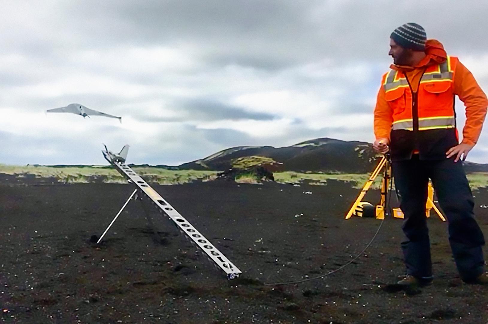 Christopher Hamilton launches a drone during flight tests in the Holuhraun, Iceland lava flow field. RAVEN builds upon recent developments in drone technology – such as NASA’s Ingenuity Mars Helicopter, accompanying the Mars 2020 rover “Perseverance.”