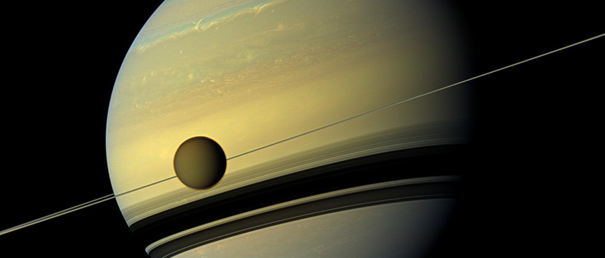A giant of a moon appears before a giant of a planet. Titan, Saturn's largest moon, measures 3,200 miles (5,150 km) across and is larger than the planet Mercury. (Photo: NASA/JPL-Caltech/Space Science Institute)