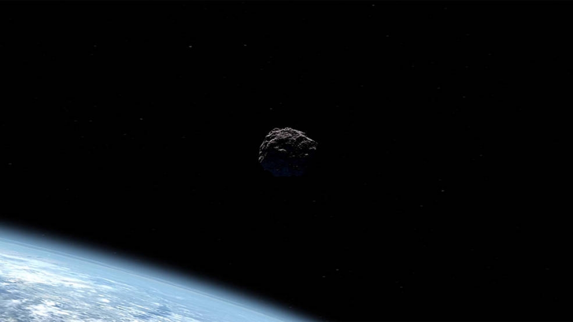 Artist's concept of an asteroid passing Earth.