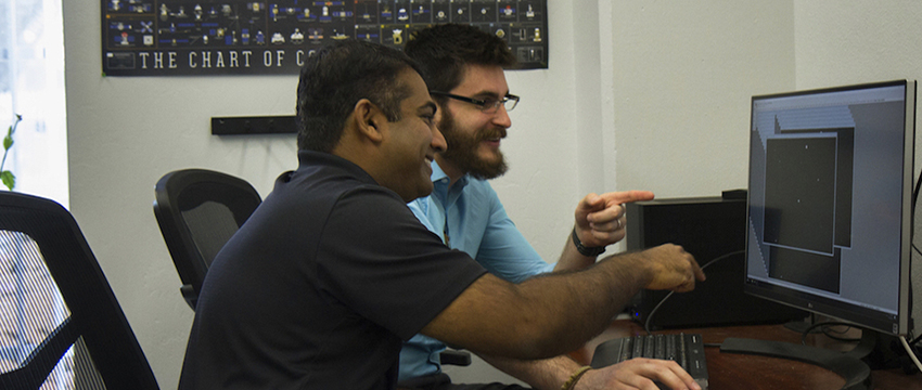 Reddy and Campbell examine their animation of a Chinese space station flyby. (Photo: Mari Cleven/Research, Discovery & Innovation)