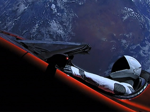 The Tesla Roadster and its mannequin passenger, Starman. This image was captured by cameras onboard the vehicle. (Image: SpaceX)