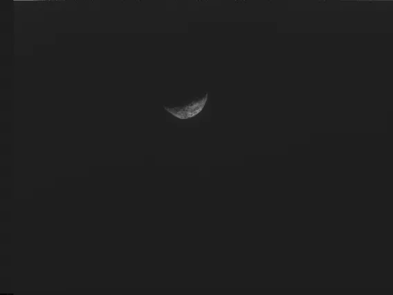 This image, the last one taken by the spacecraft, shows crescent Bennu with its night side melting with the complete black of space as the spacecraft pushed away from Bennu. The photo was taken with NavCam, one of three camera instruments designed and built by Malin Space Systems. NASA/Goddard/University of Arizona/Lockheed Martin