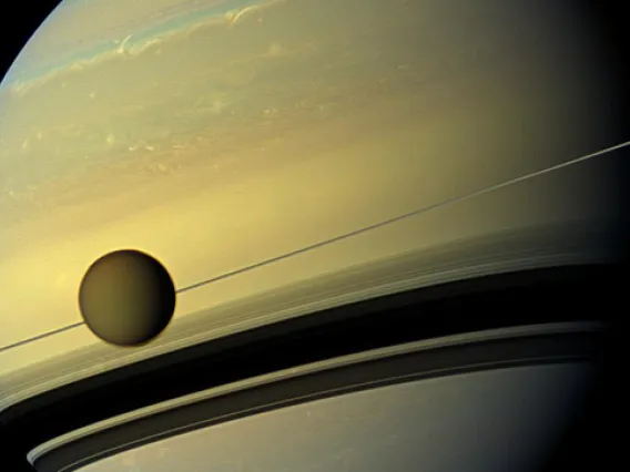 A giant of a moon appears before a giant of a planet. Titan, Saturn's largest moon, measures 3,200 miles (5,150 km) across and is larger than the planet Mercury. (Photo: NASA/JPL-Caltech/Space Science Institute)