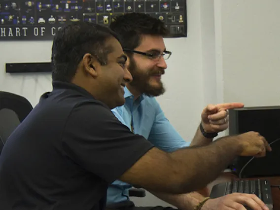 Reddy and Campbell examine their animation of a Chinese space station flyby. (Photo: Mari Cleven/Research, Discovery & Innovation)