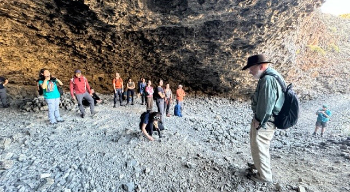 Group posing in cave