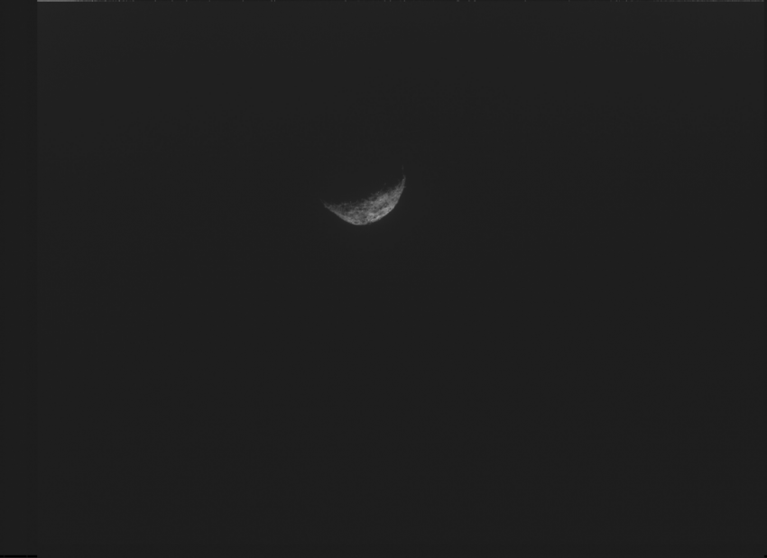 This image, the last one taken by the spacecraft, shows crescent Bennu with its night side melting with the complete black of space as the spacecraft pushed away from Bennu. The photo was taken with NavCam, one of three camera instruments designed and built by Malin Space Systems. NASA/Goddard/University of Arizona/Lockheed Martin