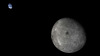 The far side of the moon, with distant Earth in the background, is visible in this photo taken by the moon-orbiting module of the Chang'e 5-T1 mission.