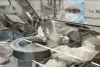 OSIRIS-REx curation team attempting to remove the two remaining fasteners